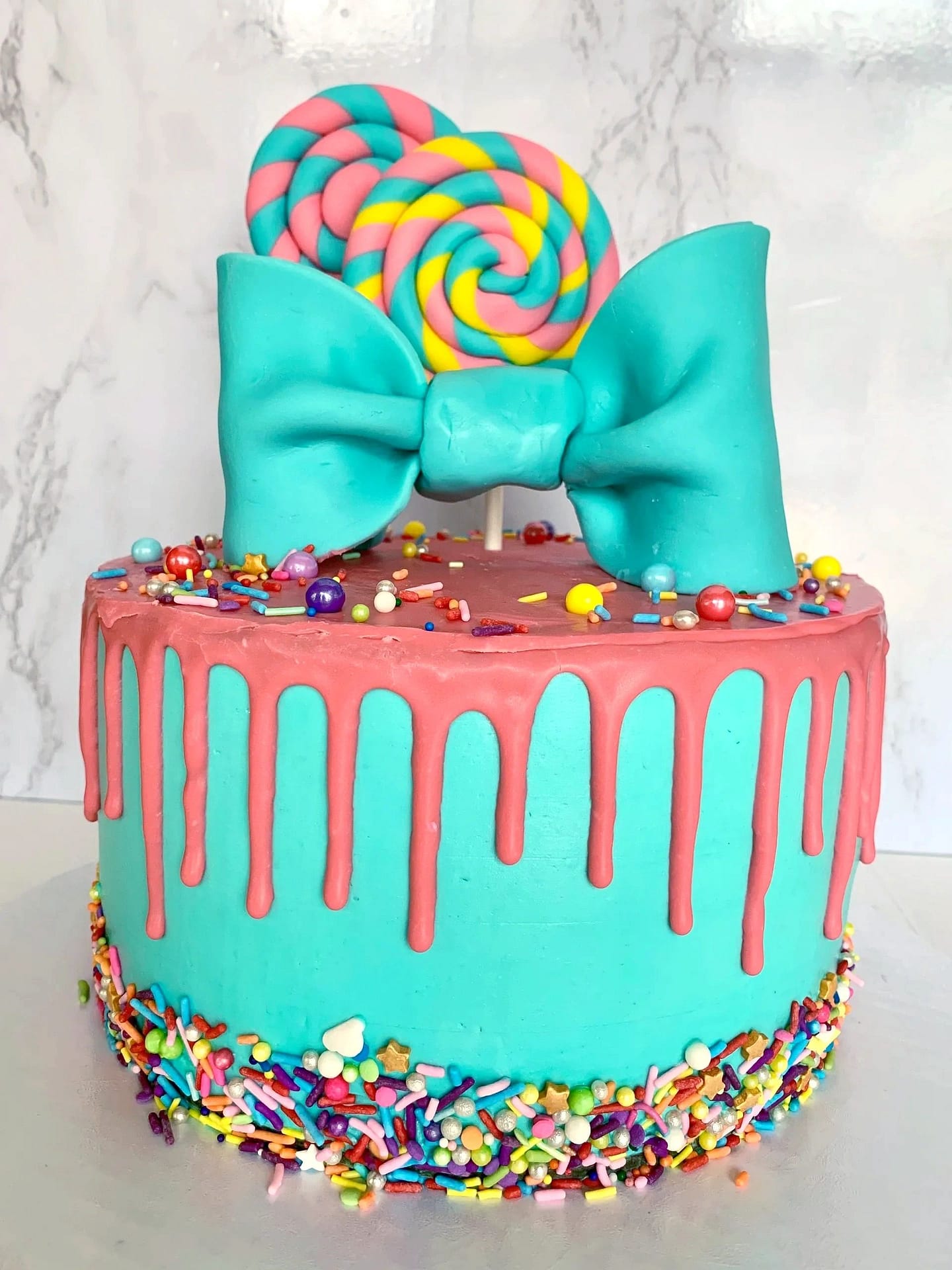 Turquoise Bow Candy Birthday Cake with Rainbow Sprinkles.